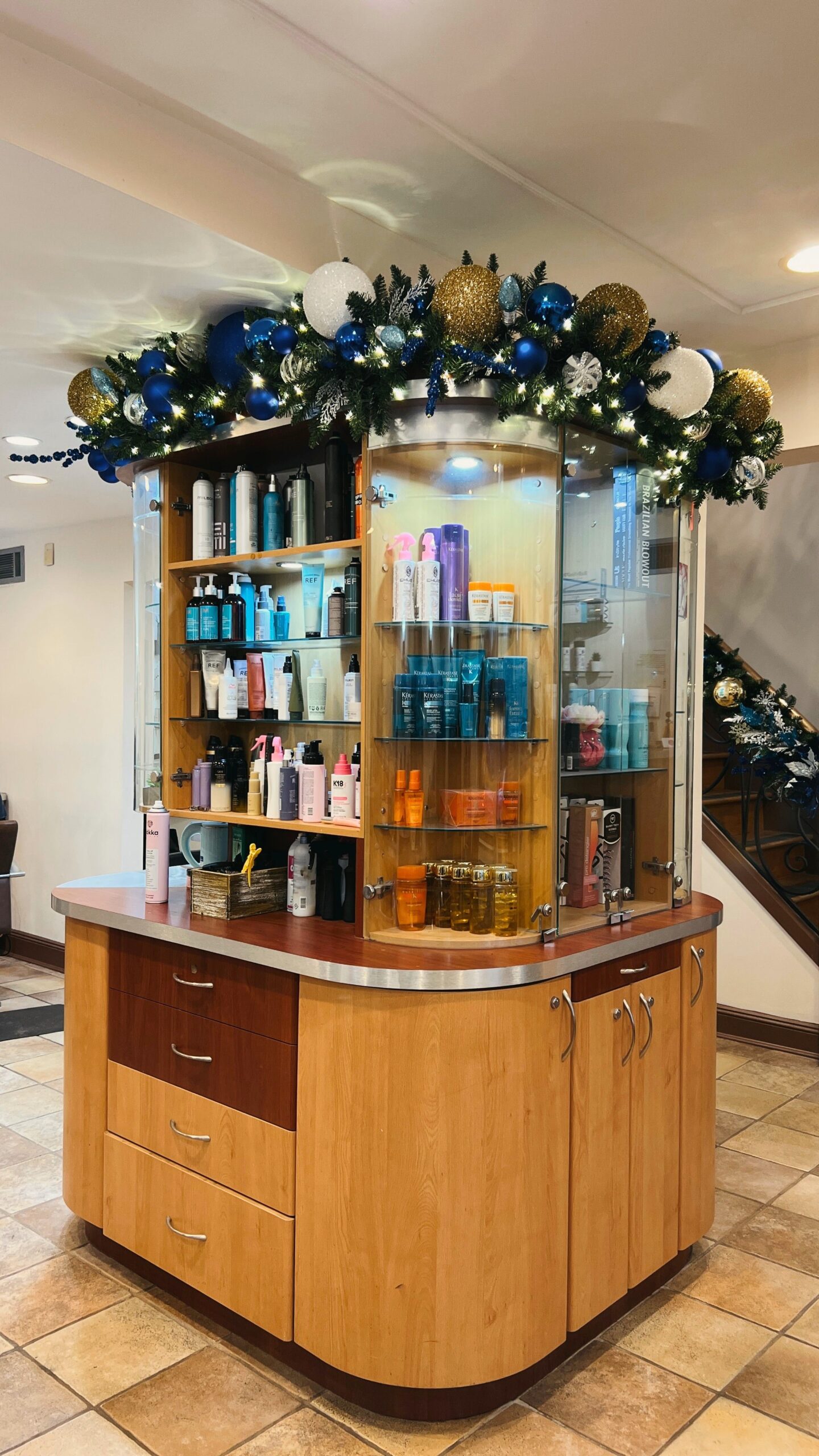 Hanukkah-inspired holiday styling detail with rich blue and metallic accents at Papillon Salon