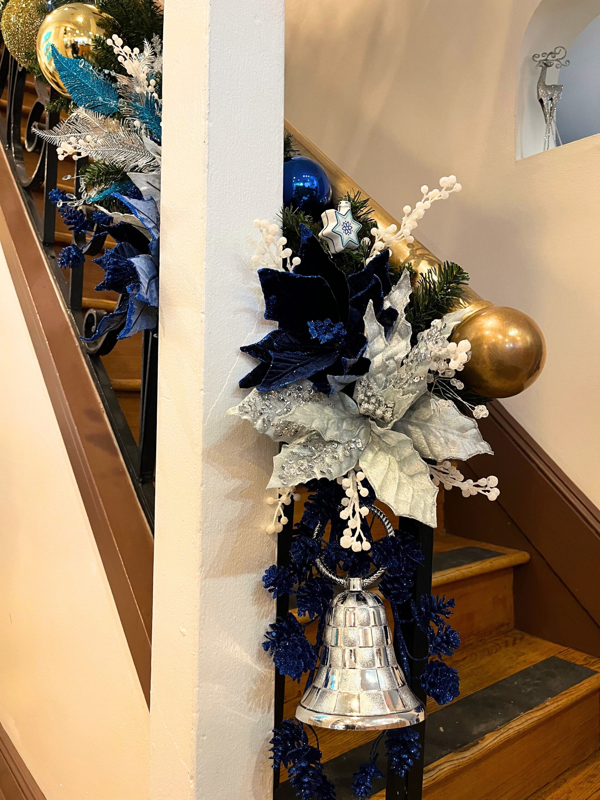 Metallic and blue holiday decor detail at Papillon Salon