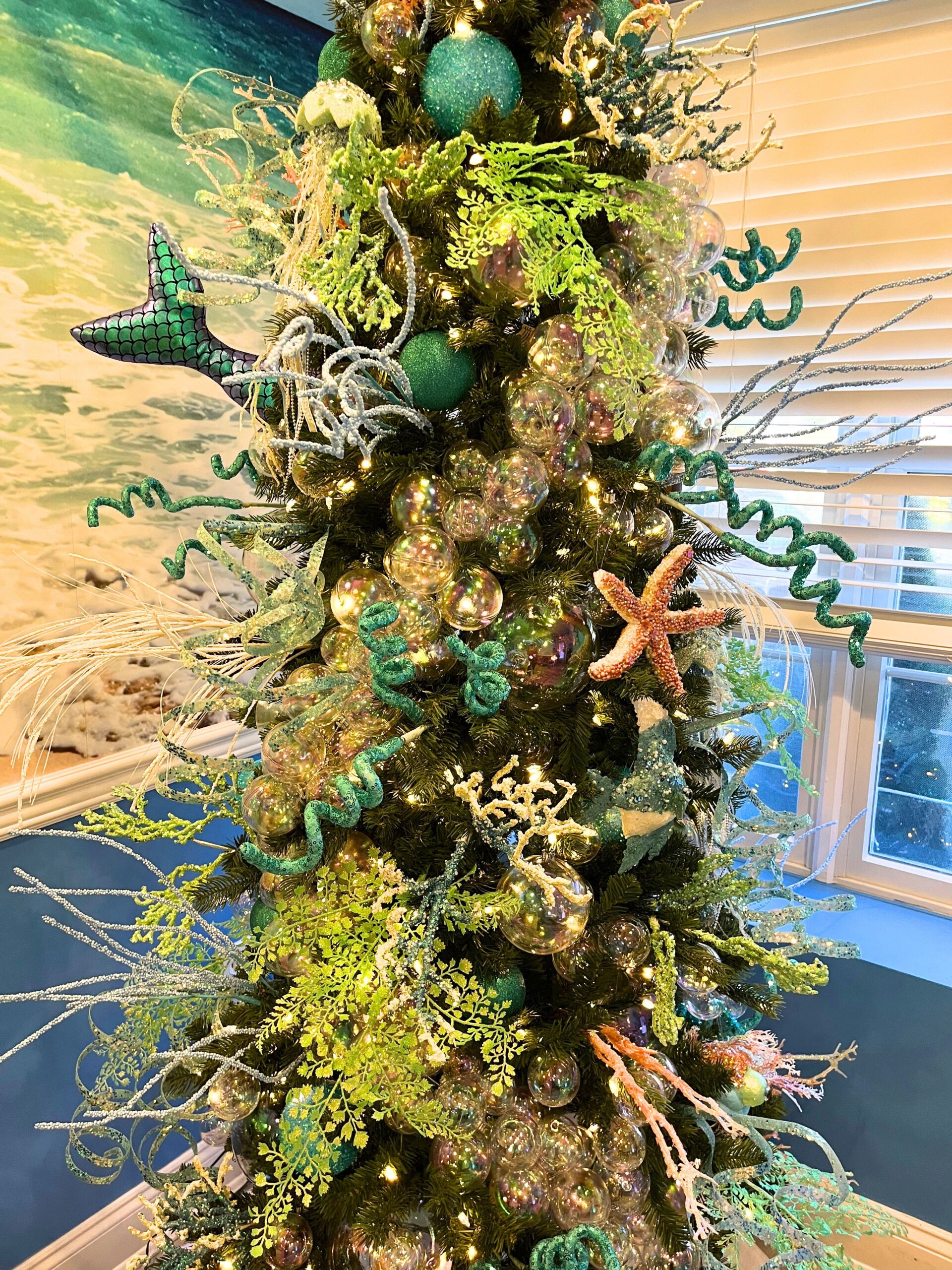Iridescent bubble and sea creature ornaments styled on the Leon Chiropractic holiday tree